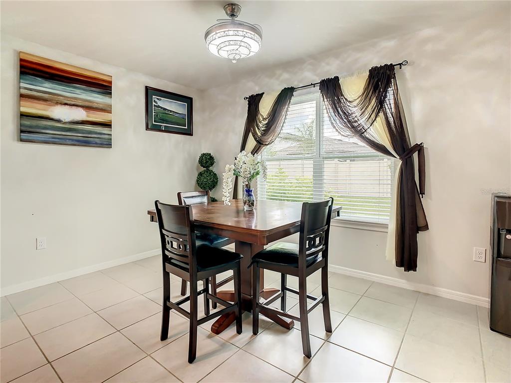 30344 Marquette Avenue Wesley Chapel, FL 33545 - Photo 15 of 71 a view of a dining room with furniture