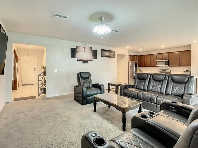 a living room with furniture and a couch