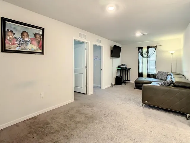 a bedroom with a bed and furniture