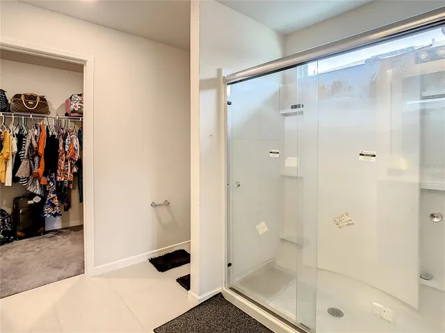 a kitchen with kitchen island a sink stainless steel appliances and cabinets