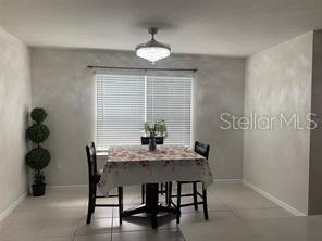 30344 Marquette Avenue Wesley Chapel, FL 33545 - Photo 47 of 71 a view of a dining room with furniture and wooden floor