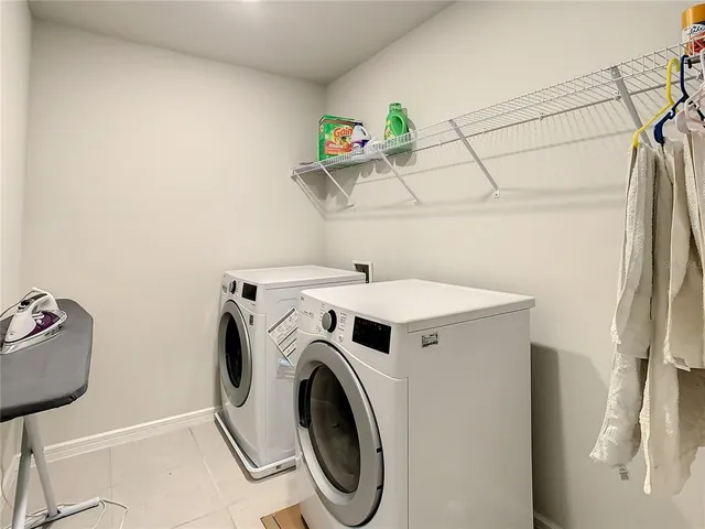an aerial view of a house with a swimming pool yard and outdoor seating
