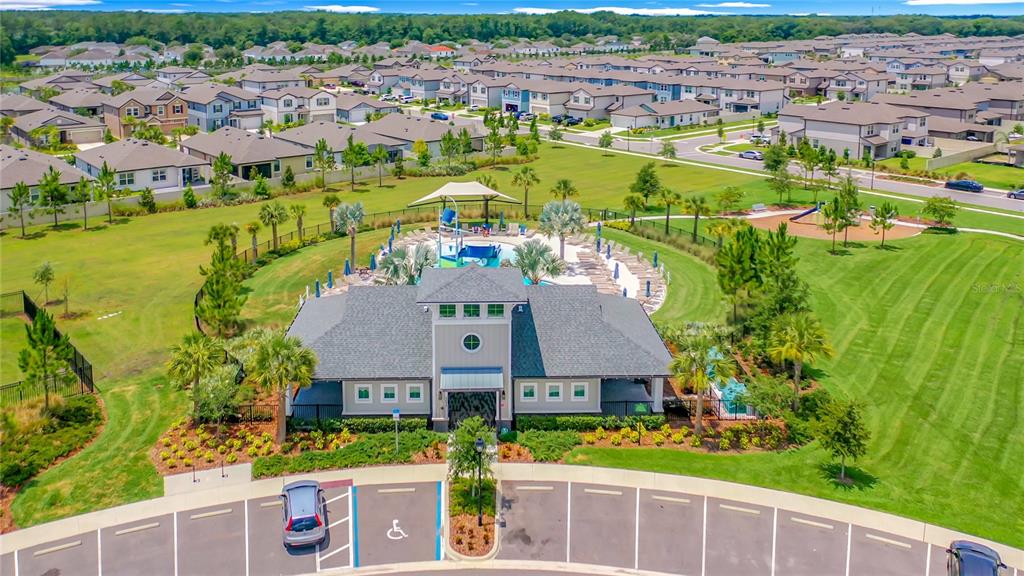 30344 Marquette Avenue Wesley Chapel, FL 33545 - Photo 67 of 71 an aerial view of residential houses with outdoor space and swimming pool