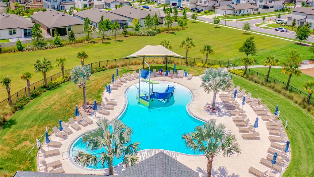 30344 Marquette Avenue Wesley Chapel, FL 33545 - Photo 69 of 71 an aerial view of a house with a swimming pool yard and outdoor seating
