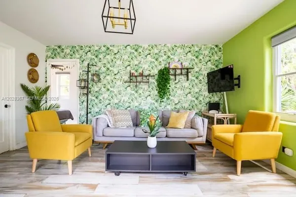 a living room with furniture and a flat screen tv