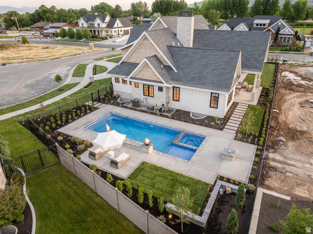 423 Eldorado Drive Mapleton, UT 84664 - Photo 3 of 40 Relaxing pool / spa featuring a fenced backyard, a patio area, and a residential view