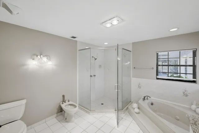 a view of a lake with a table and chairs