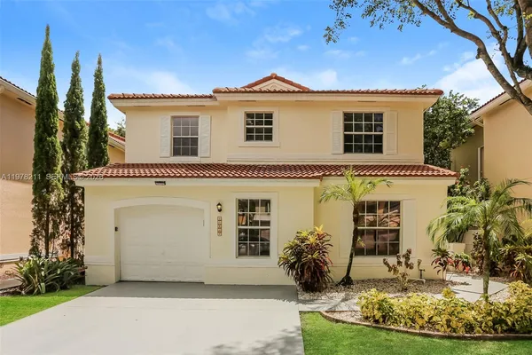 a view of a house with a yard
