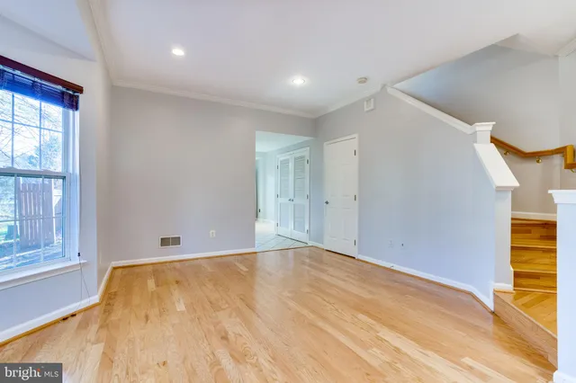 a kitchen with a sink a counter top stainless steel appliances and cabinets