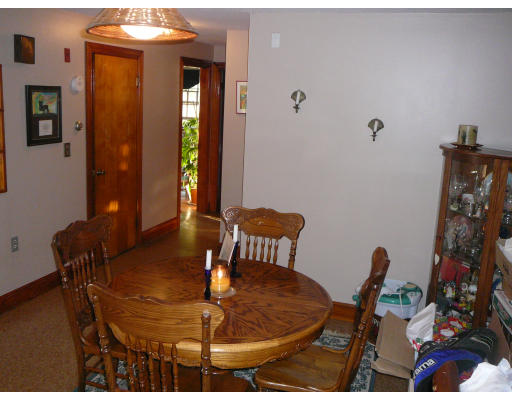 75 Holmes Street Halifax, MA 02338 - Photo 11 of 29 a view of a dining room with furniture and wooden floor