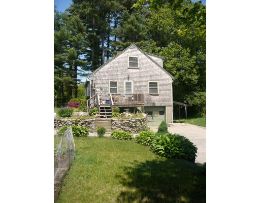 75 Holmes Street Halifax, MA 02338 - Photo 15 of 29 a view of a backyard with plants and large trees