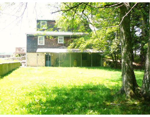 75 Holmes Street Halifax, MA 02338 - Photo 24 of 29 a view of swimming pool with a garden and trees