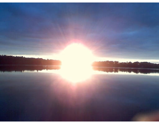 75 Holmes Street Halifax, MA 02338 - Photo 5 of 29 a sunset view with a lake