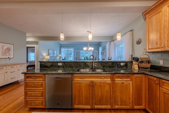 16 Fairway Drive, Unit 16 Topsfield, MA 01983 - Photo 11 of 31 a kitchen with granite countertop a sink cabinets and stainless steel appliances