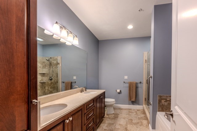 16 Fairway Drive, Unit 16 Topsfield, MA 01983 - Photo 21 of 31 a bathroom with a sink and a mirror