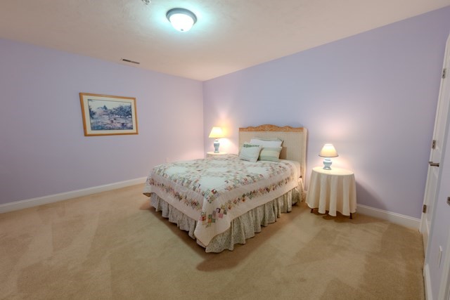 16 Fairway Drive, Unit 16 Topsfield, MA 01983 - Photo 28 of 31 a bedroom with a bed and window