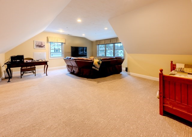 16 Fairway Drive, Unit 16 Topsfield, MA 01983 - Photo 30 of 31 a living room with furniture and a flat screen tv