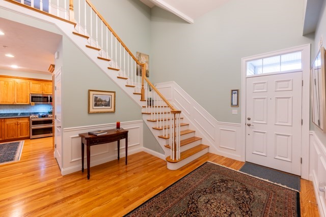 16 Fairway Drive, Unit 16 Topsfield, MA 01983 - Photo 6 of 31 a view of entryway dining room and hall with wooden floor