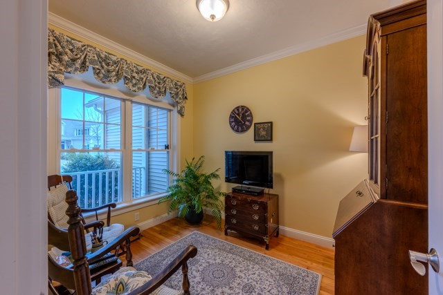 16 Fairway Drive, Unit 16 Topsfield, MA 01983 - Photo 8 of 31 a living room with furniture and a flat screen tv