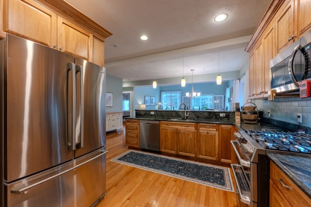 16 Fairway Drive, Unit 16 Topsfield, MA 01983 - Photo 10 of 31 a kitchen with stainless steel appliances granite countertop a refrigerator and a stove