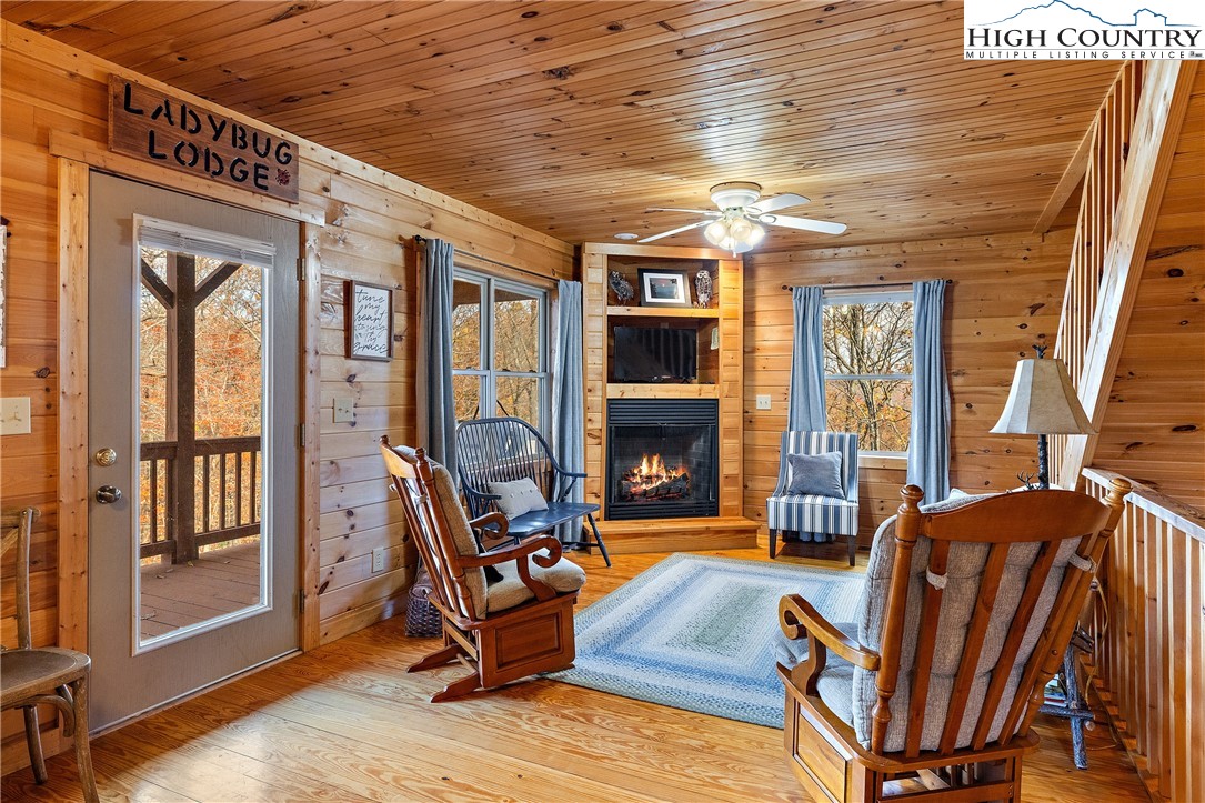 2935 Buck Mountain Road Purlear, NC 28665 - Photo 11 of 49 a living room with furniture a fireplace and a table