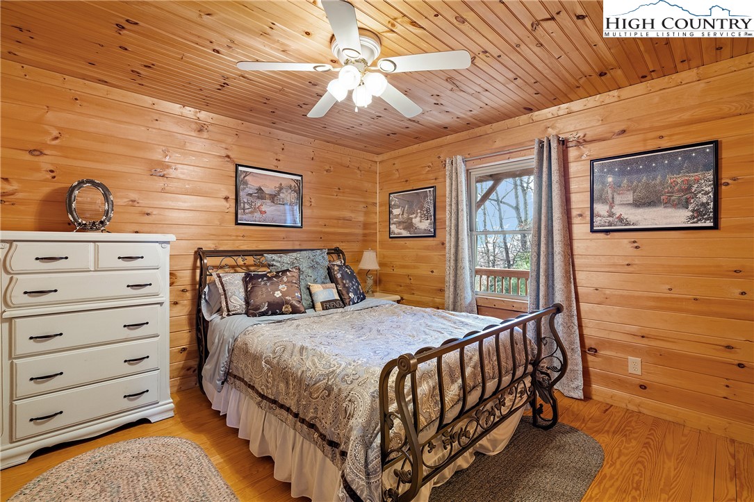 2935 Buck Mountain Road Purlear, NC 28665 - Photo 19 of 49 a bedroom with a bed and a dresser