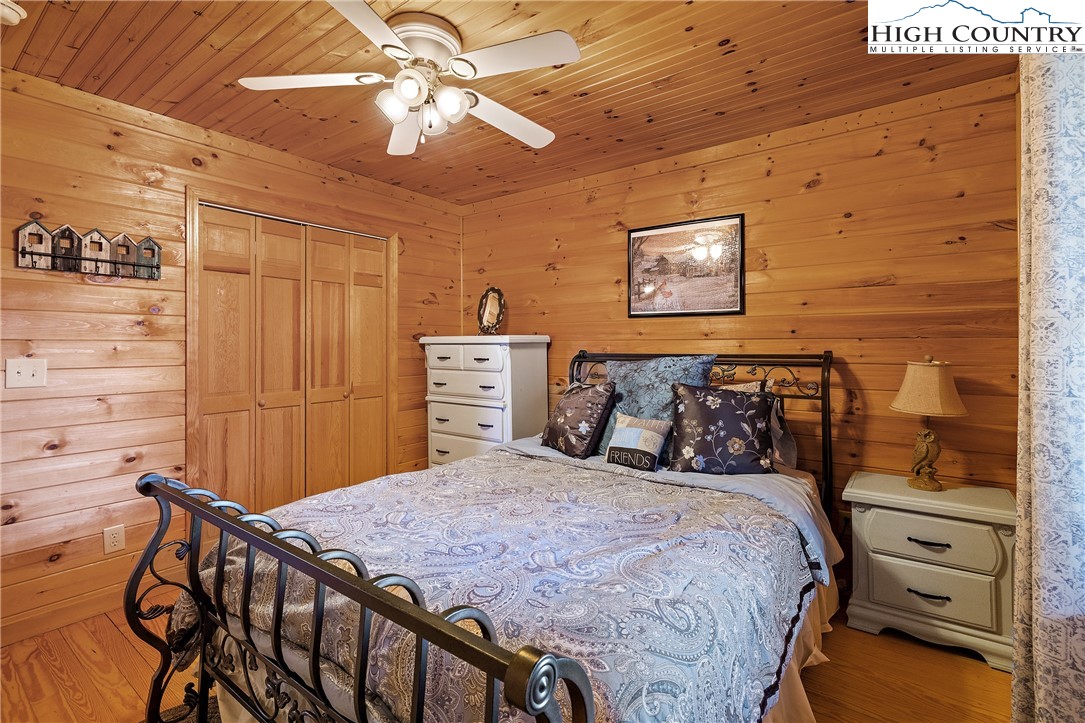 2935 Buck Mountain Road Purlear, NC 28665 - Photo 20 of 49 a bedroom with a bed and a closet