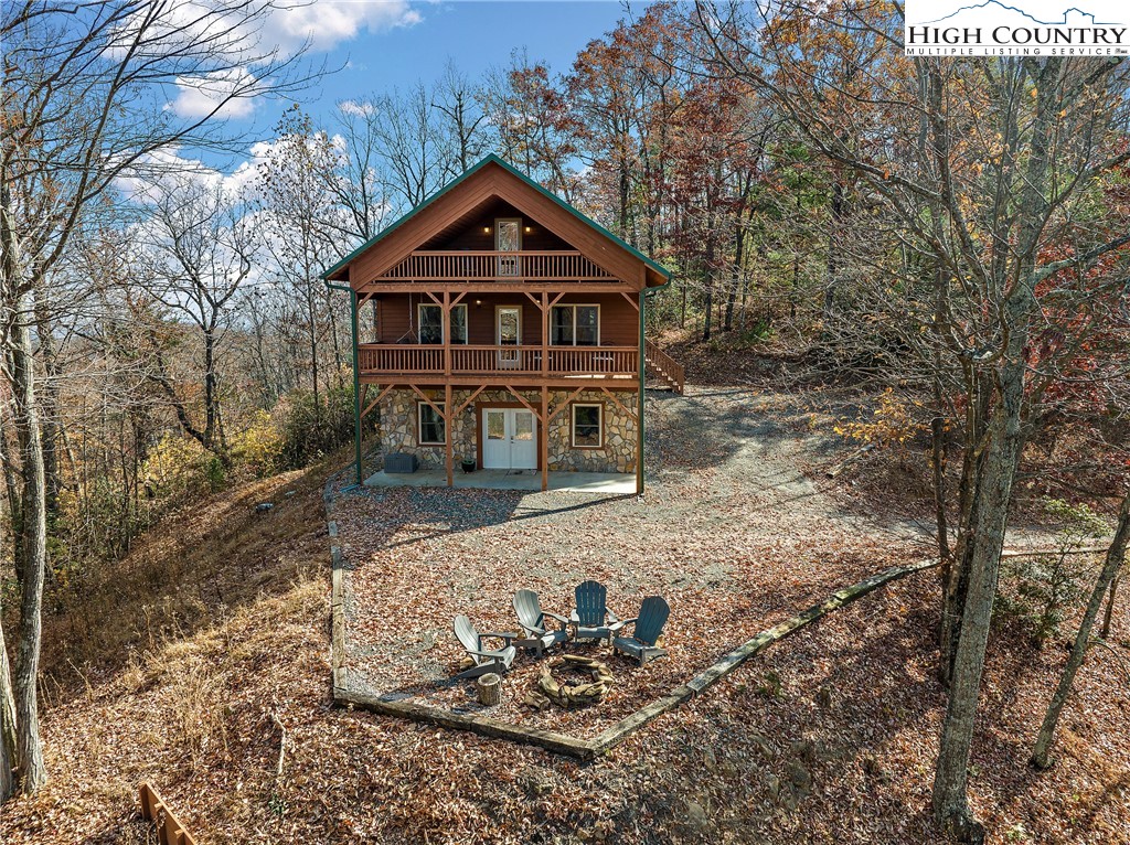 2935 Buck Mountain Road Purlear, NC 28665 - Photo 2 of 49 a front view of a house with a yard