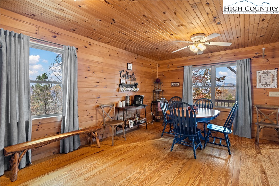 2935 Buck Mountain Road Purlear, NC 28665 - Photo 23 of 49 a view of a dining room with furniture window and wooden floor