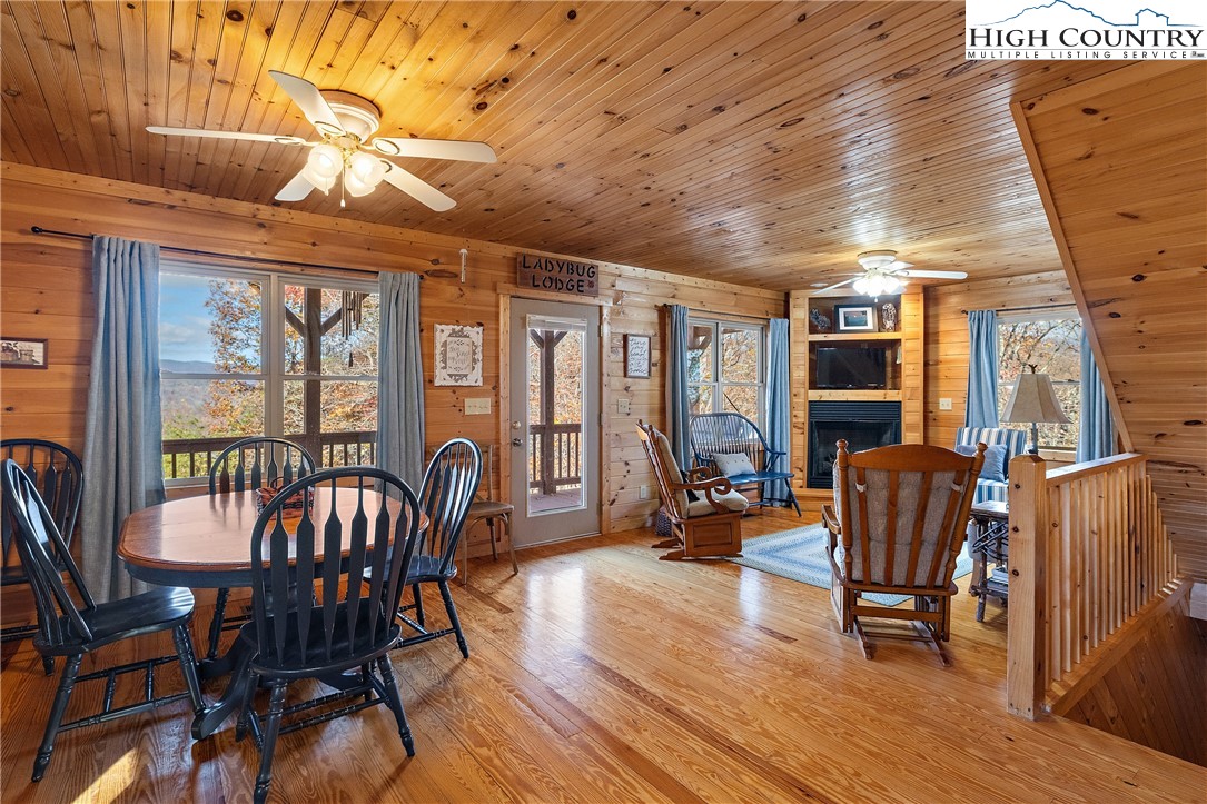 2935 Buck Mountain Road Purlear, NC 28665 - Photo 24 of 49 a view of a dining room with furniture window and wooden floor