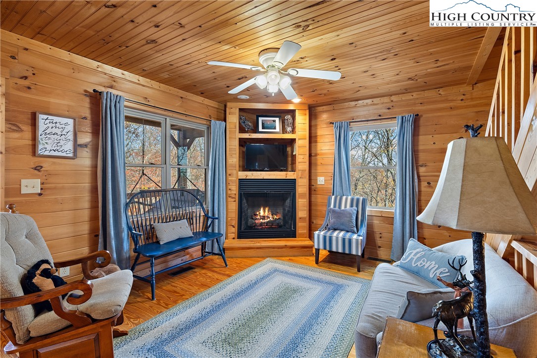 2935 Buck Mountain Road Purlear, NC 28665 - Photo 25 of 49 a living room with furniture and a fireplace