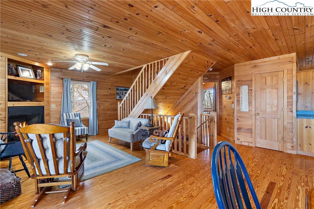 2935 Buck Mountain Road Purlear, NC 28665 - Photo 27 of 49 a view of an empty room with wooden floor and furniture
