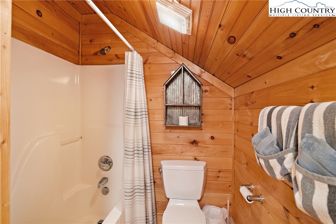 2935 Buck Mountain Road Purlear, NC 28665 - Photo 34 of 49 a bathroom with a toilet sink and shower