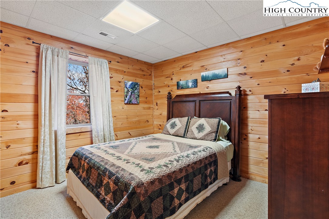 2935 Buck Mountain Road Purlear, NC 28665 - Photo 40 of 49 a bedroom with a bed and walk in closet