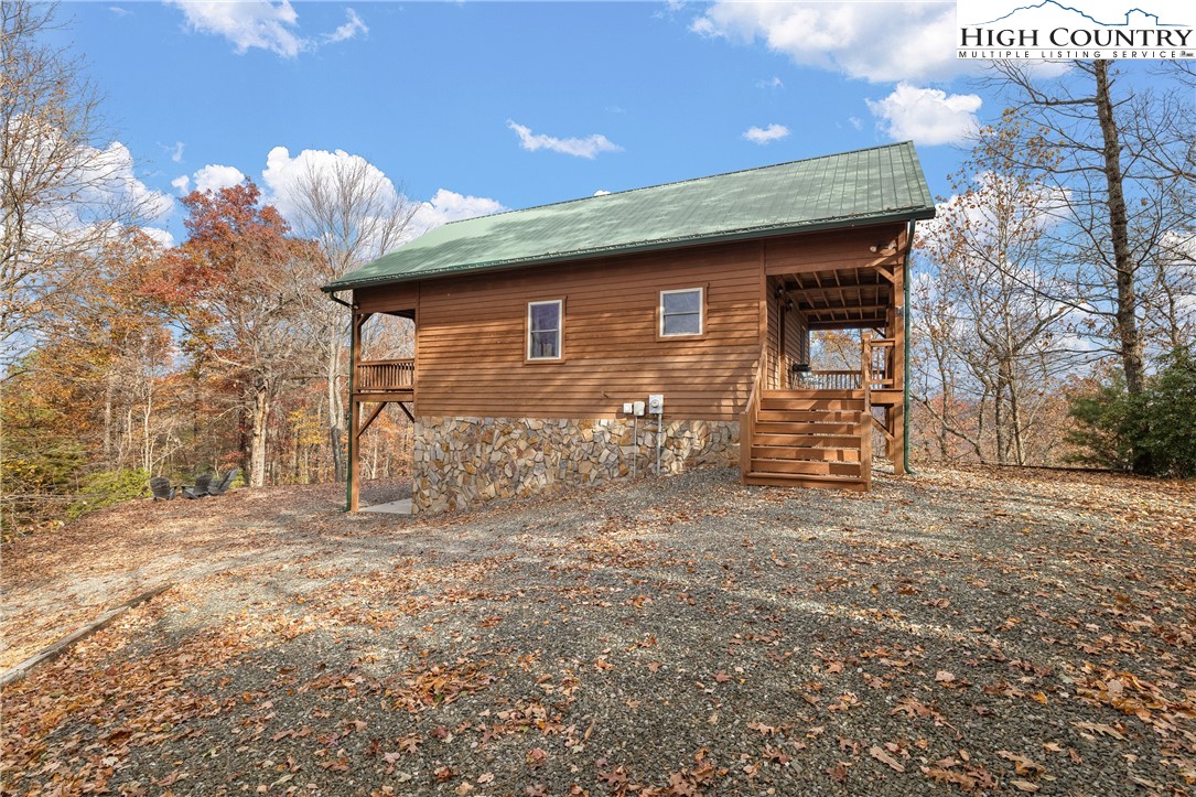 2935 Buck Mountain Road Purlear, NC 28665 - Photo 4 of 49 a front view of a house with garden