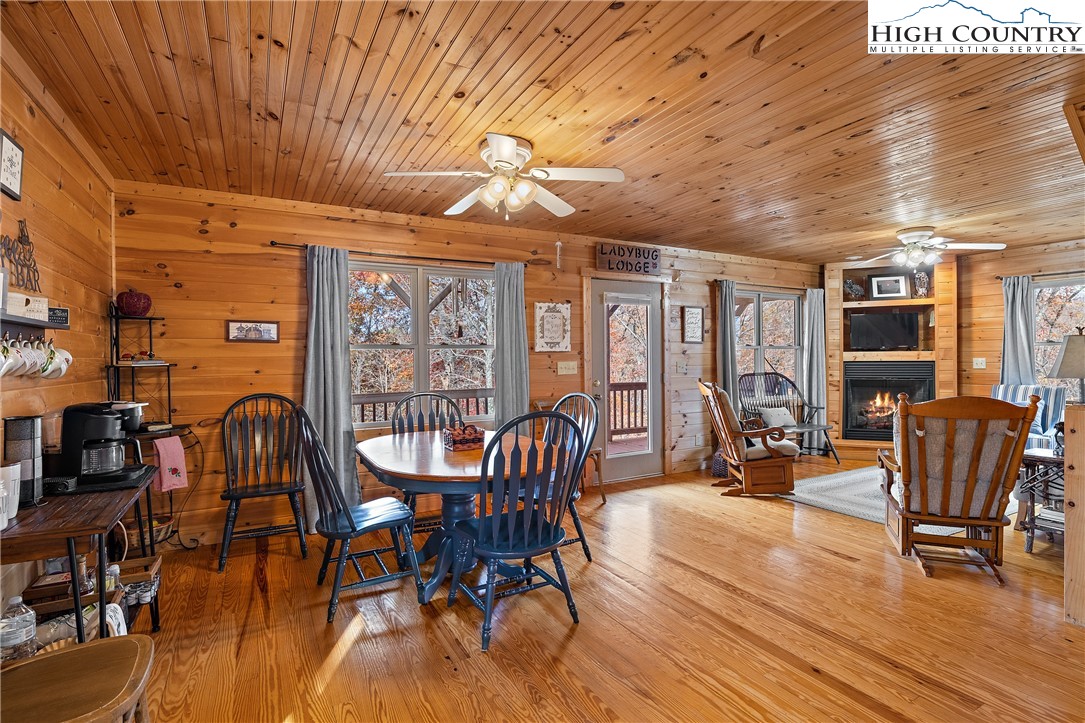 2935 Buck Mountain Road Purlear, NC 28665 - Photo 10 of 49 a dining room with furniture window wooden floor