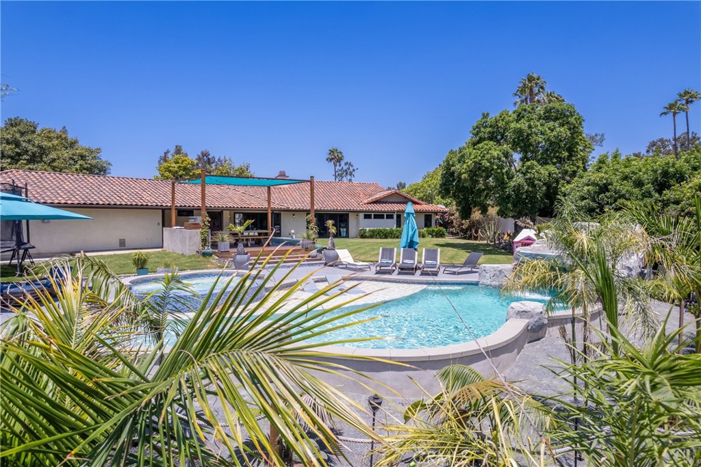 7337 La Soldadera Rancho Santa Fe, CA 92067 - Photo 39 of 60 a view of a swimming pool with a patio