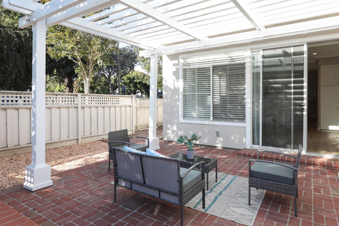 491 Villa Street Mountain View, CA 94041 - Photo 18 of 19 a outdoor space with patio the couches and a dining table and chairs with wooden floor