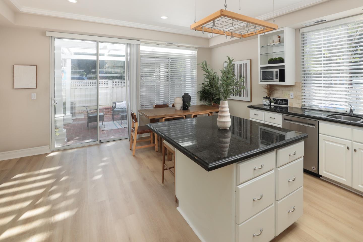 491 Villa Street Mountain View, CA 94041 - Photo 6 of 19 a kitchen with a stove a sink and dishwasher with wooden floor
