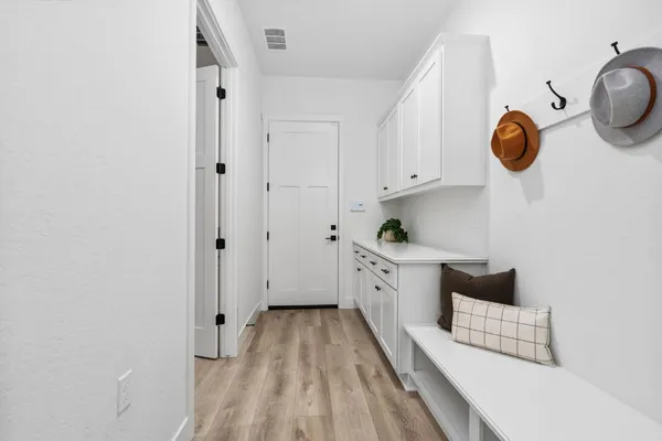 a kitchen that has a table and chairs in it
