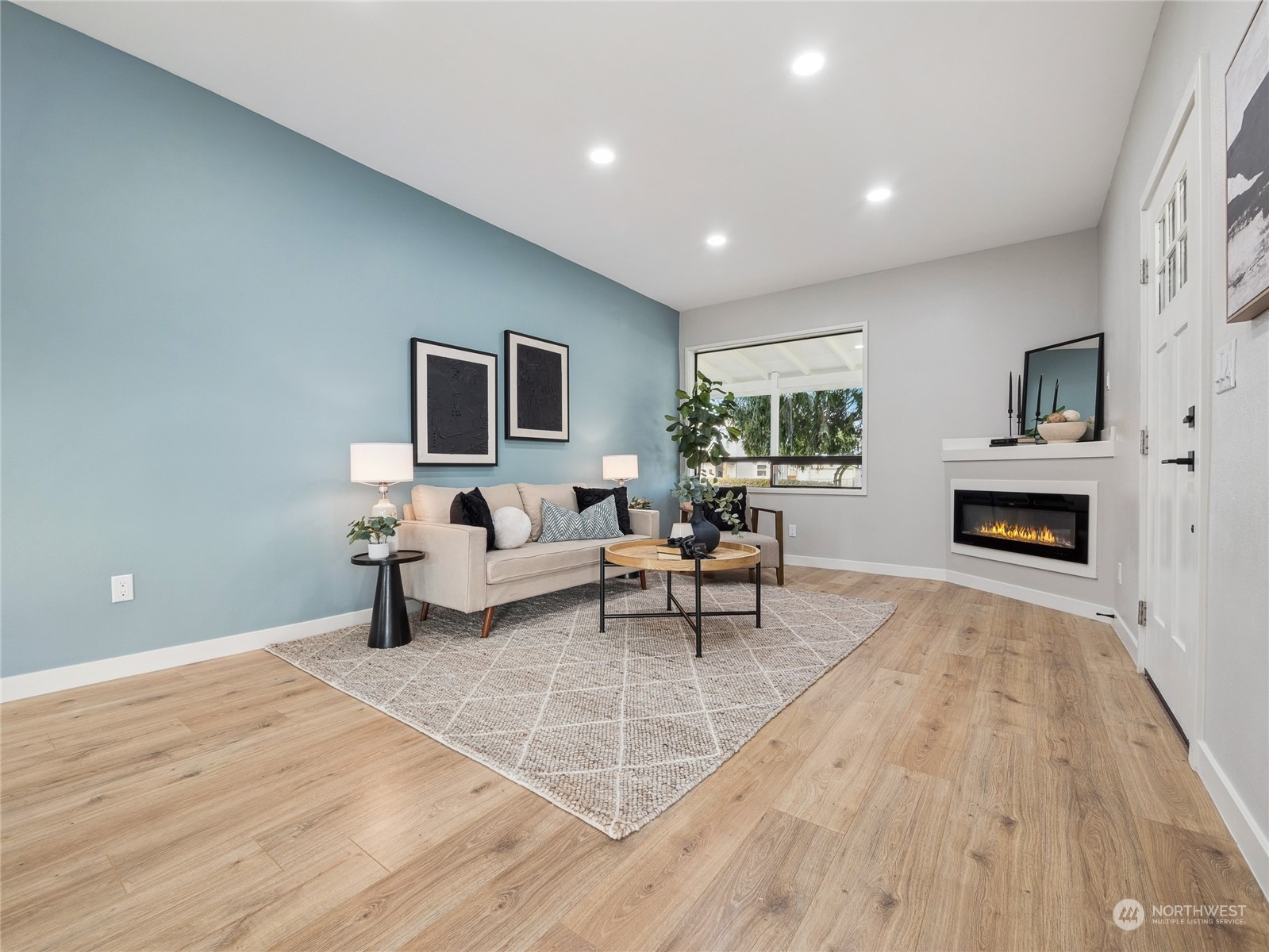 1502 16th Street Sumner, WA 98390 - Photo 11 of 26 a living room with furniture and a fireplace