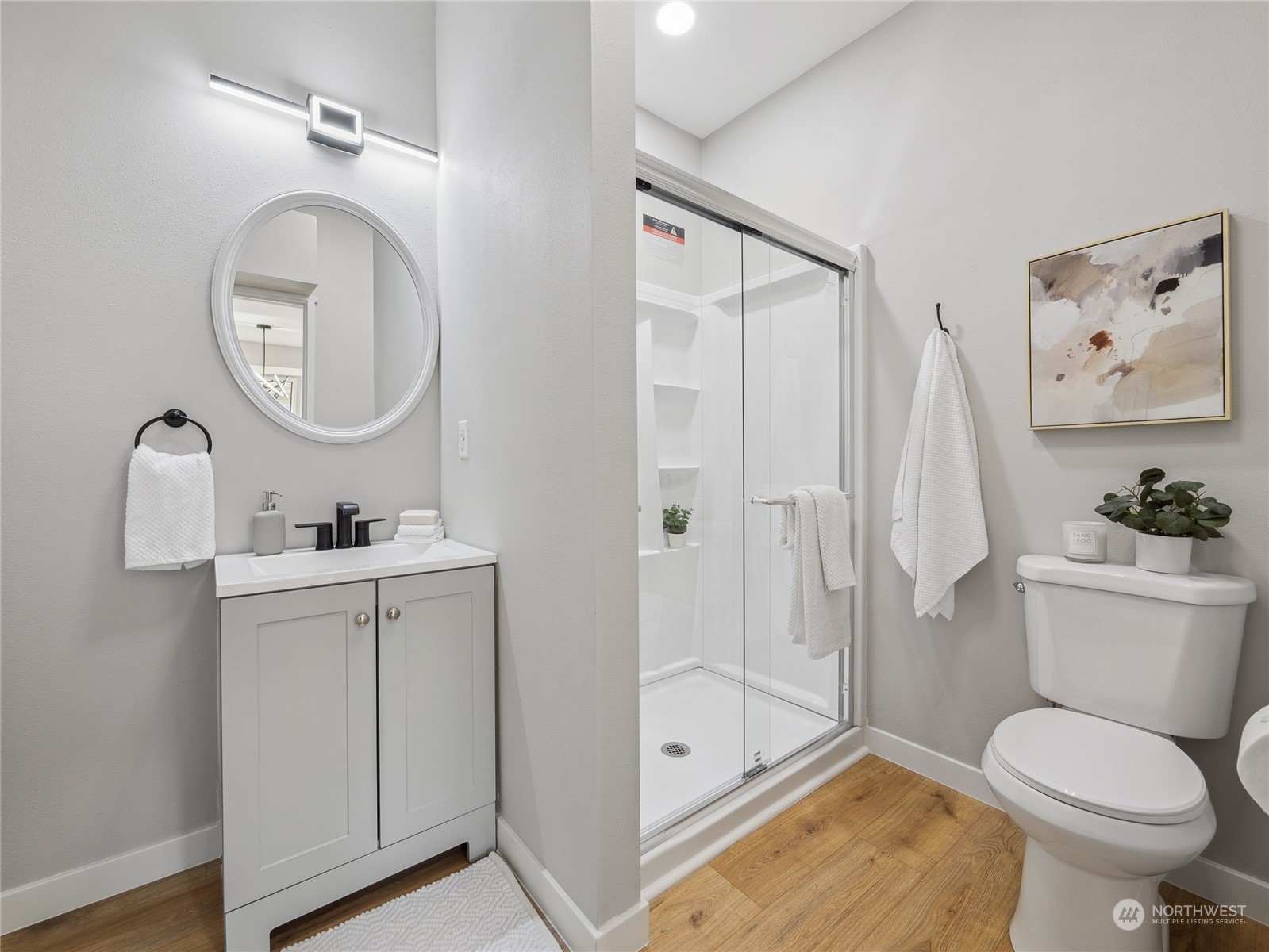 1502 16th Street Sumner, WA 98390 - Photo 17 of 26 a bathroom with a toilet sink and shower