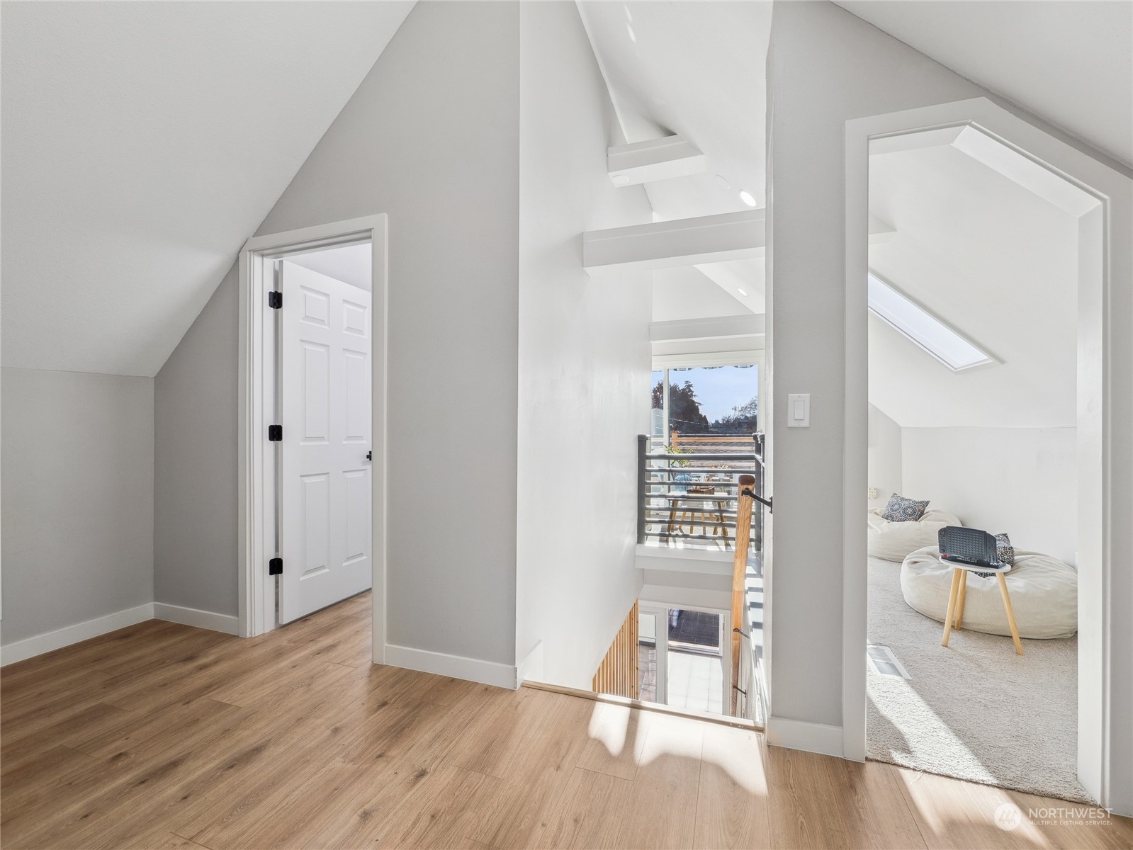 1502 16th Street Sumner, WA 98390 - Photo 21 of 26 a view of a livingroom with wooden floor and a bathroom