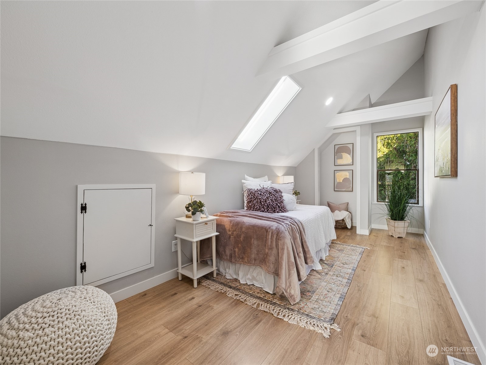 1502 16th Street Sumner, WA 98390 - Photo 22 of 26 a bedroom with a bed and a window