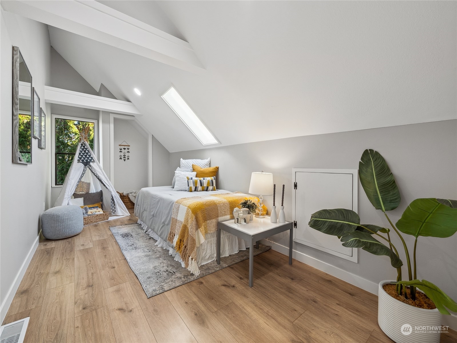 1502 16th Street Sumner, WA 98390 - Photo 23 of 26 a bedroom with furniture and a wooden floor
