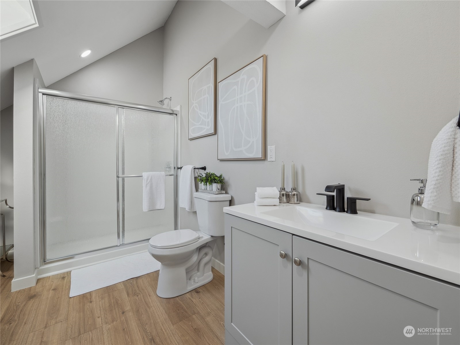 1502 16th Street Sumner, WA 98390 - Photo 24 of 26 a bathroom with a sink toilet and shower