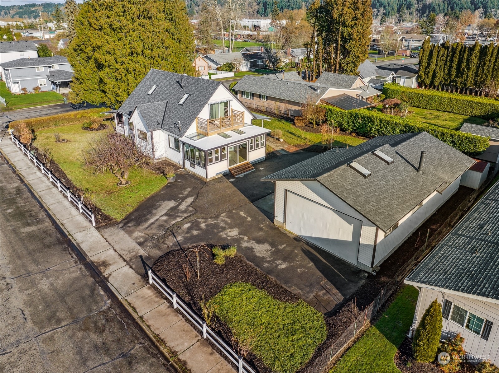 1502 16th Street Sumner, WA 98390 - Photo 25 of 26 an aerial view of residential houses with outdoor space