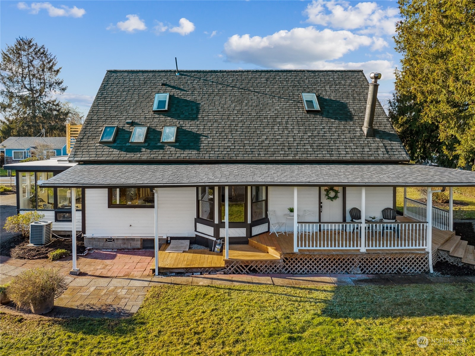 1502 16th Street Sumner, WA 98390 - Photo 4 of 26 a view of a house with swimming pool and sitting area