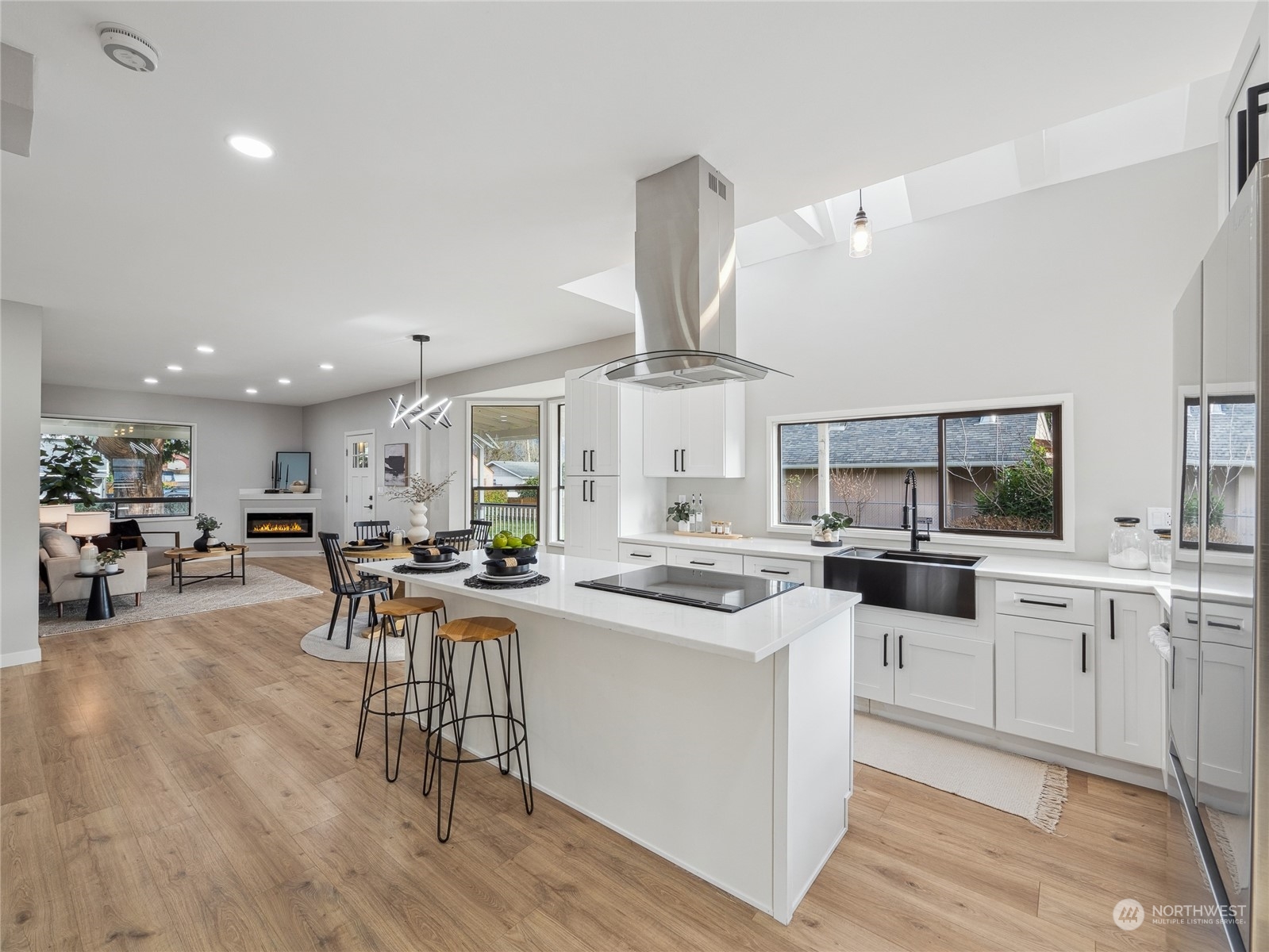 1502 16th Street Sumner, WA 98390 - Photo 8 of 26 a kitchen with stainless steel appliances a stove a sink dishwasher and a refrigerator