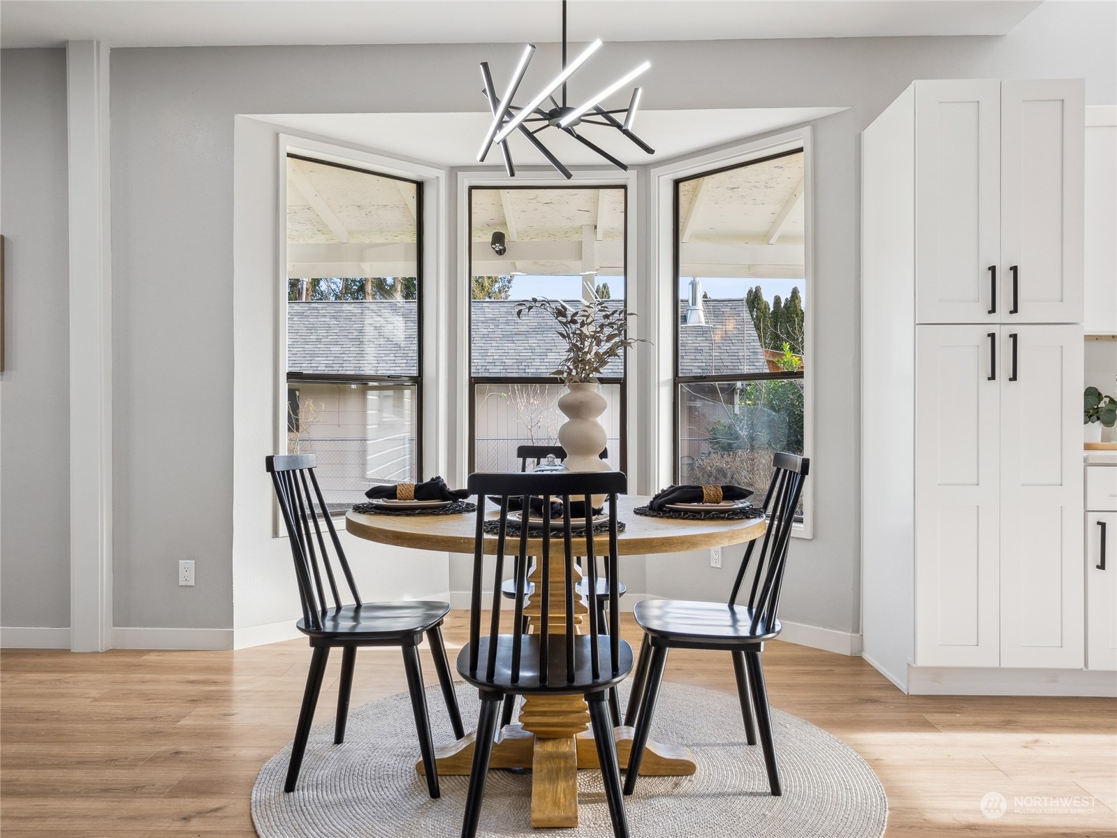 1502 16th Street Sumner, WA 98390 - Photo 10 of 26 a view of a dining room with furniture window and wooden floor